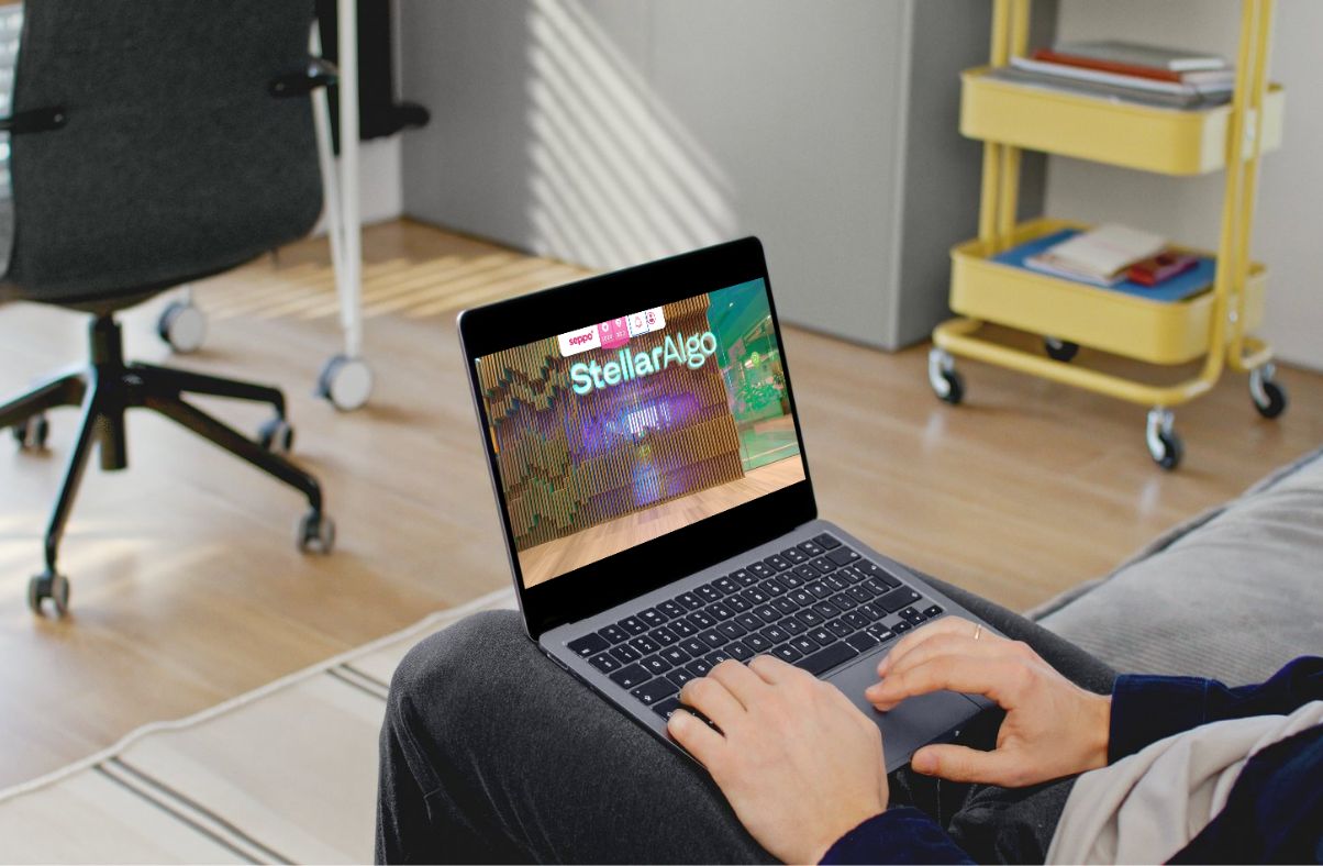Person using a laptop to play the Seppo StellarAgo onbaording game.