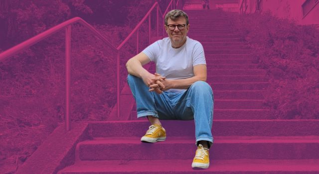 Riku Alkio sitting on outdoor steps.